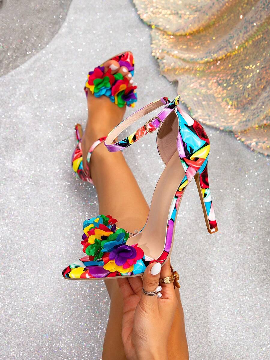 Step into summer style with these eye-catching high heel sandals featuring vibrant butterfly and flower designs. Perfect for adding a pop of color to your warm-weather wardrobe, these sandals blend comfort with fashion-forward flair. Whether you're heading to a garden party, brunch with friends, or a casual night out, these playful heels elevate any outfit. The intricate floral and butterfly details make them a conversation starter, while the sleek silhouette keeps them versatile enough to pair with dresses