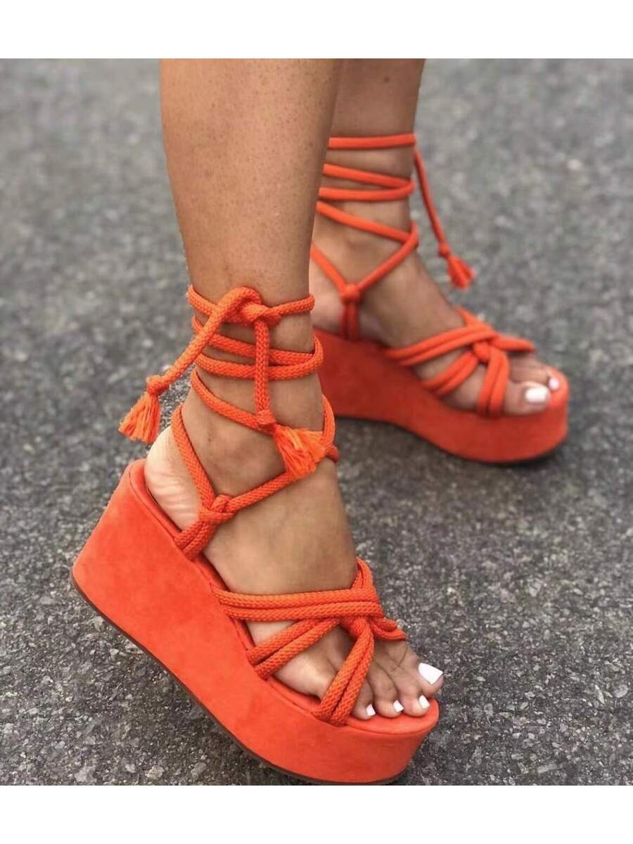 Step out in style with these playful lace-up wedge heel sandals designed just for you! Featuring a thick sole for extra comfort and a flattering lift, these summer sandals are perfect for sunny days and warm nights. Available in plus sizes, they combine fashion and function effortlessly, making every step feel lighthearted and chic. Embrace the season with a fresh twist on your footwear collection!