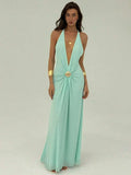 Full front view of mint green deep V halter maxi dress with flowing length