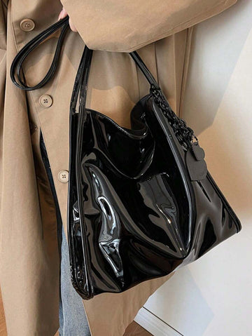 Meet your new favorite sidekick: a chic patent leather tote that’s as roomy as your weekend plans. This stylish shoulder and bucket bag in a trendy solid color lets you carry all your essentials—and then some—without sacrificing an ounce of flair. Perfect for daily use, it combines fashion and function effortlessly, making it the bag you’ll reach for again and again.