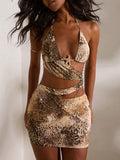 Turn heads in this stunning leopard print mini dress designed for those who love bold style. Featuring a daring backless halter neckline with an asymmetrical knot detail, this bodycon dress hugs your curves beautifully. The mesh fabric with medium stretch offers comfort and movement, while the lined construction ensures coverage. Perfect for concerts, festivals, and night-out occasions, this sleek brown dress makes a statement. Pair it with heels and confidence for an unforgettable look.