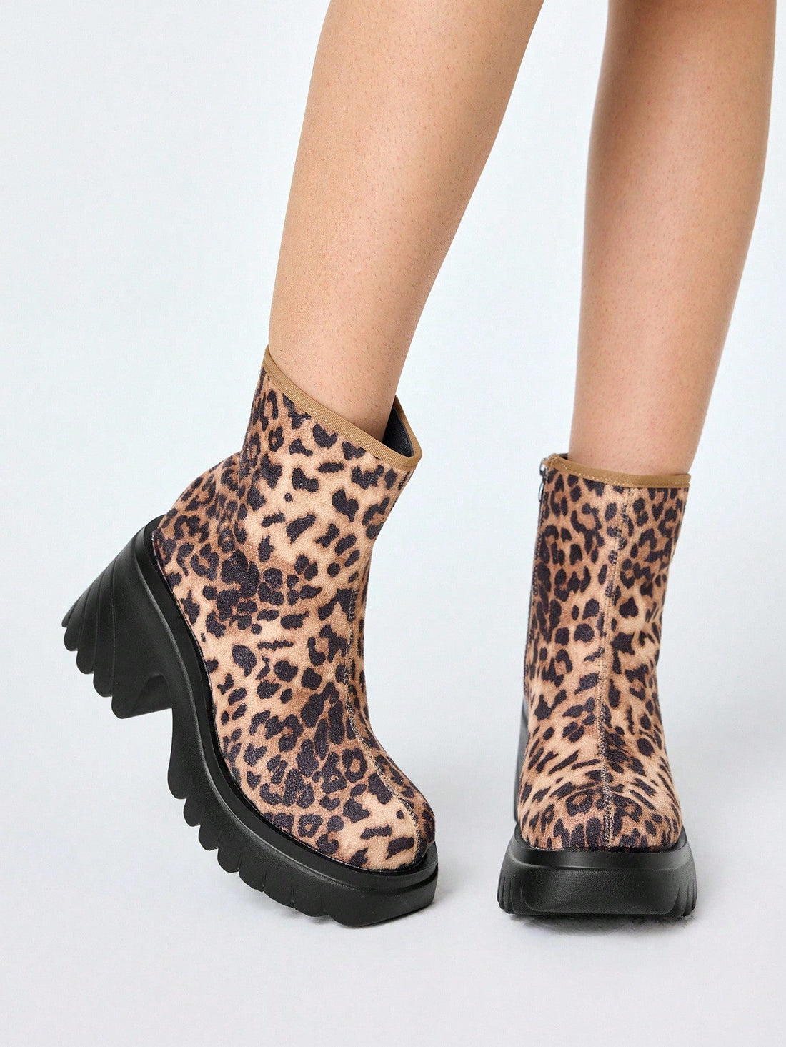 Step up your style game with these playful leopard print lace-up ankle boots! Perfect for adding a bold gothic rock vibe, these platform mid-calf booties blend fierce fashion with edgy punk attitude. They’re made to turn heads and let your wild side roam free wherever you go.