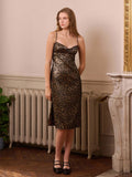 Turn heads at your next autumn or winter celebration in this stunning leopard print lurex long dress. The shimmering lurex fabric catches the light beautifully, while delicate spaghetti straps offer an effortlessly chic silhouette. Perfect for holiday parties, festive gatherings, or any occasion that calls for a touch of wild glamour. The timeless leopard pattern pairs with the dress's flowing length for a look that's both sophisticated and undeniably fun. Make a statement and own the room in this showstopp
