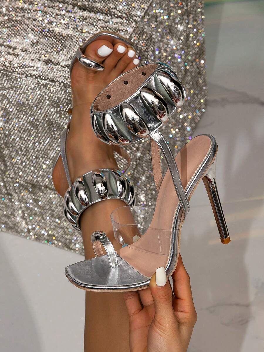 Step out in dazzling style with these Metallic Gold Stiletto High Heel Sandals! Featuring a chic T-strap design, they add a sparkle to every party or outdoor event. The slender heels boost your height while keeping you looking effortlessly glamorous. Perfect for dancing the night away or turning heads wherever you go!