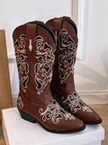 Step into the season with these stylish mid-calf brown boots, featuring eye-catching embroidery that adds a dash of Western flair to your look. Perfect for keeping cozy in autumn and winter, they blend timeless charm with playful spirit. Whether you're hitting the town or strolling through crisp leaves, these boots bring both warmth and wow-factor to every step.