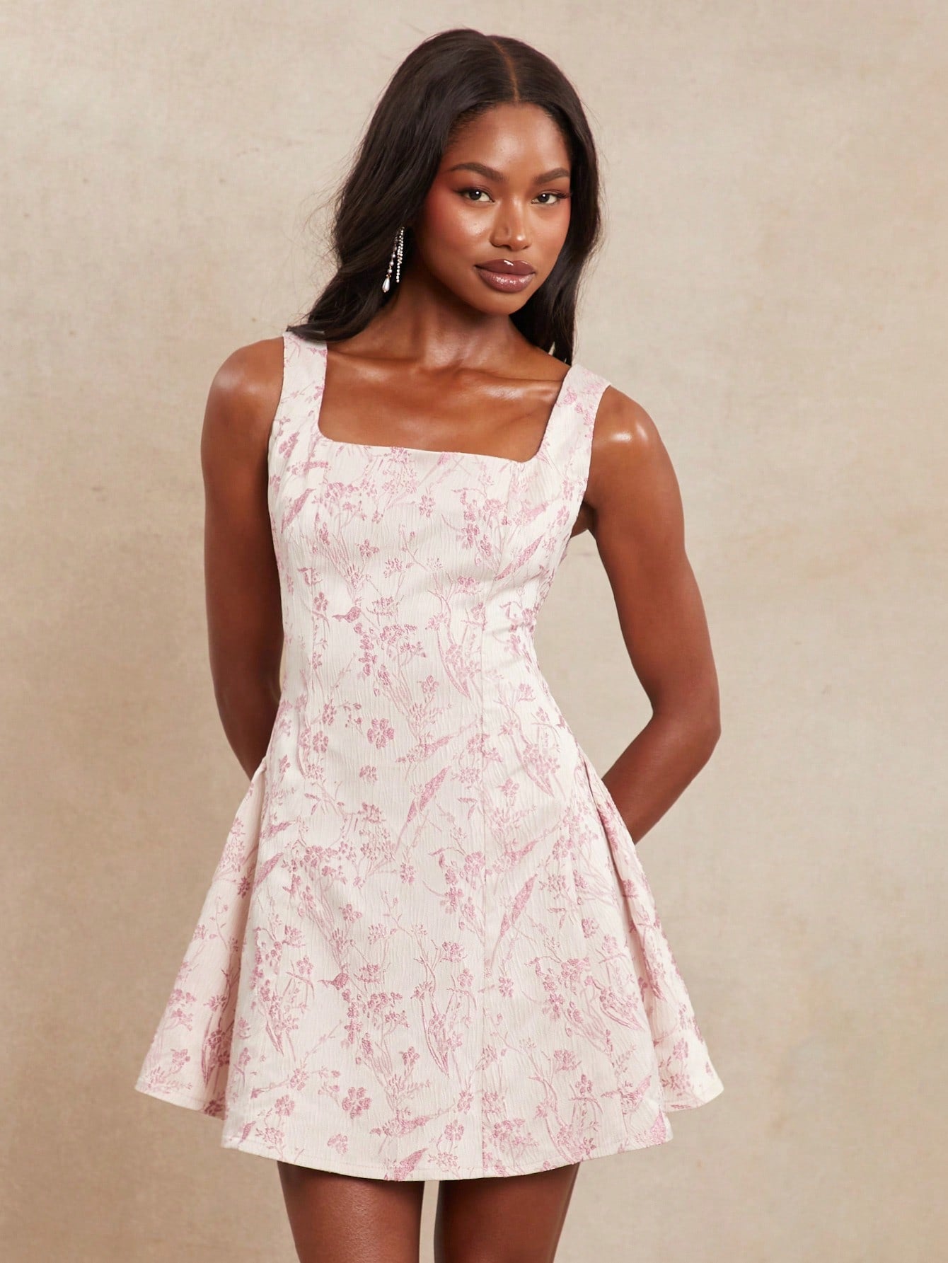 Twirl into summer with this flirty floral jacquard sundress! The mini length shows off your sun-kissed legs while the vacation-ready design keeps you looking fabulous at beach parties, garden weddings, or brunch with the girls. This little number transitions effortlessly from daytime adventures to evening cocktails – just add accessories and you're ready to dance the night away!