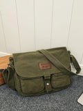 Crafted from durable canvas, this messenger bag combines vintage Japanese aesthetics with practical functionality. The spacious interior accommodates daily essentials, while strategically placed pockets keep smaller items organized and accessible. Its structured silhouette and adjustable shoulder strap provide comfortable, hands-free carrying for work, travel, or casual outings. The retro Harajuku-inspired design adds character to any wardrobe, making it equally suited for fashion-forward styling or underst