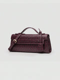 Ostrich embossed structured top handle shoulder bag with flap closure and adjustable strap