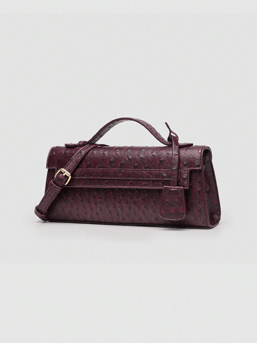 Ostrich embossed structured top handle shoulder bag with flap closure and adjustable strap