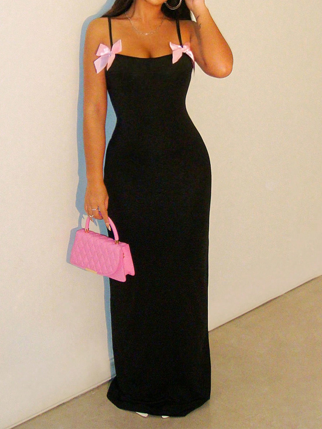 Turn heads this season in our stunning pink bow strap sleeveless maxi dress! Designed for effortless elegance, this showstopper features delicate bow-detailed straps and a flowing silhouette that skims beautifully from shoulder to floor. Perfect for summer soirées, beach weddings, or any occasion calling for a touch of feminine charm. The breathable fabric keeps you cool and comfortable while the timeless pink hue flatters every complexion. Whether you're dressing up for an event or elevating your everyday 
