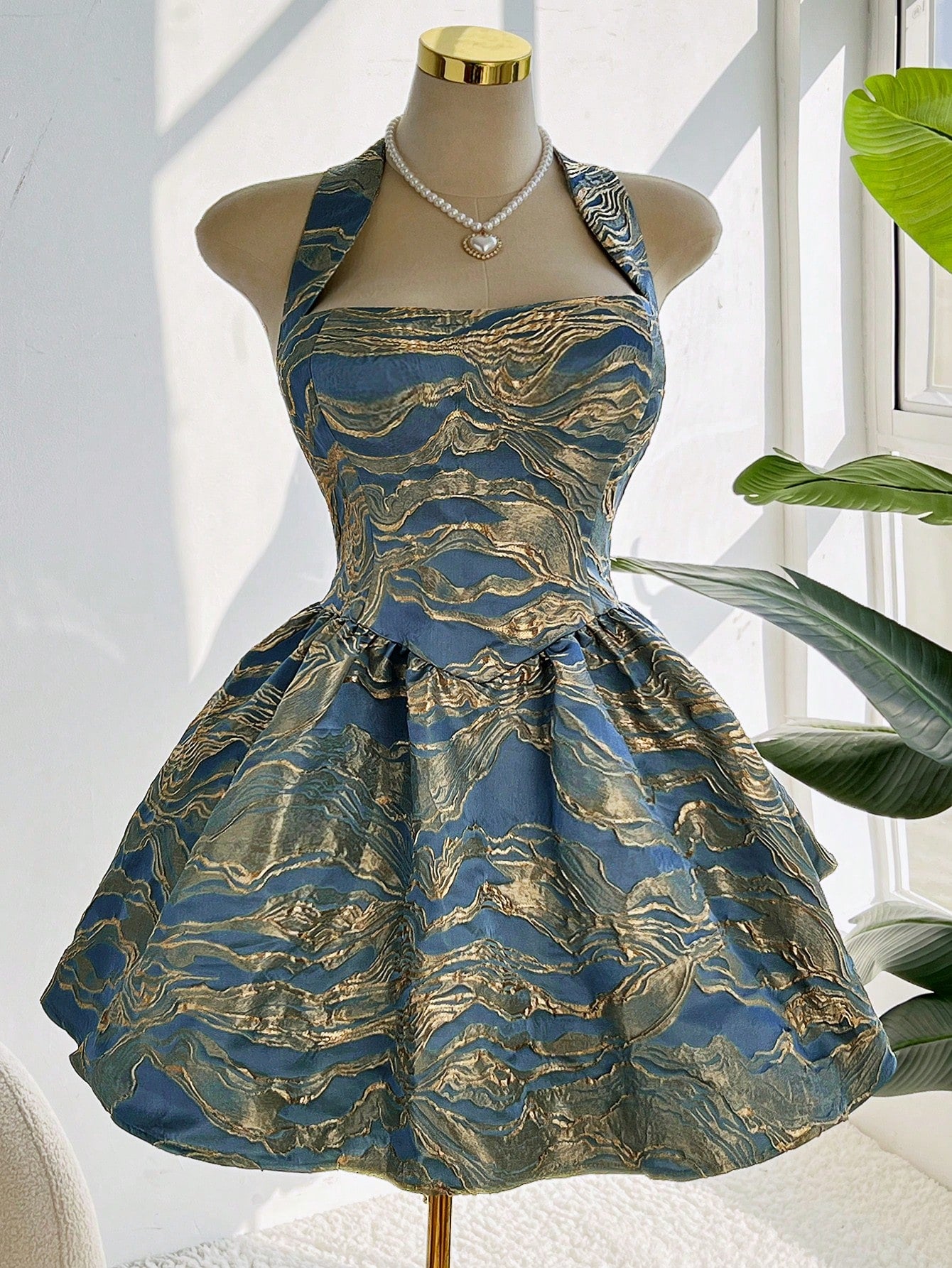 Step into fall with flair in this playful plus size blue sleeveless jacquard puff dress. Its textured fabric and puffed silhouette add fun volume, while the sleeveless cut keeps it breezy and easy to layer. Perfect for effortless style that turns heads wherever you go!