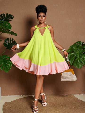 Flaunt your curves in this playful colorblock dress that's ready for summer fun! The flirty ruffle hem adds movement while spaghetti straps keep you cool during warm-weather adventures. Perfect for beach getaways, backyard BBQs, or wherever your summer holidays take you. This plus-size stunner combines style and comfort for unforgettable seasonal moments.