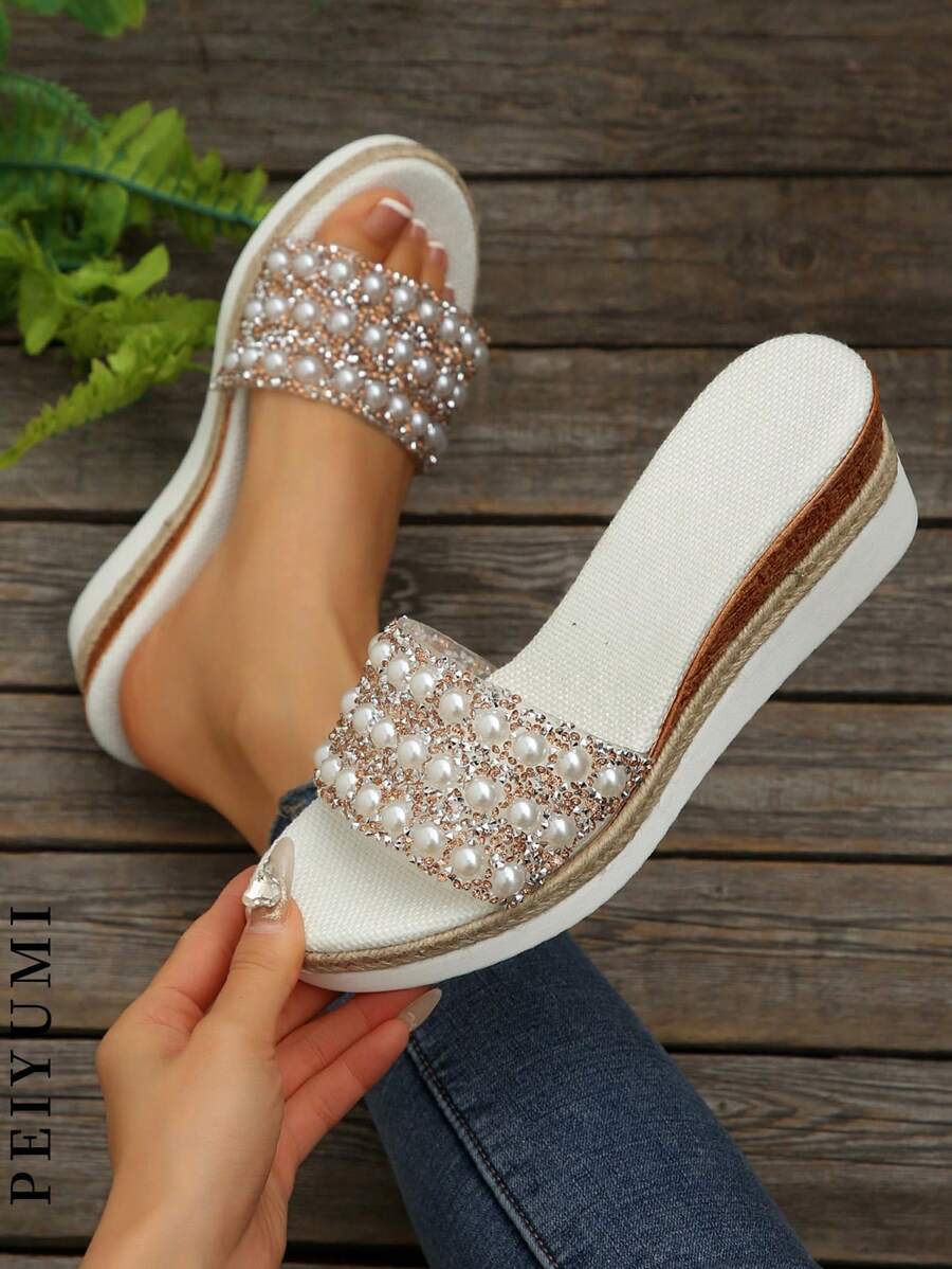 Step into summer with these playful plus size platform sandals, handcrafted with shimmering pearls and sparkling rhinestones. Perfect for beach days or sunny strolls, they add a touch of glamour while keeping you comfortable and confident. Let your feet shine and enjoy every step in style!