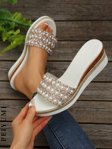 Step into summer with these playful plus size platform sandals, handcrafted with shimmering pearls and sparkling rhinestones. Perfect for beach days or sunny strolls, they add a touch of glamour while keeping you comfortable and confident. Let your feet shine and enjoy every step in style!