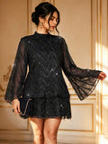 Front view of black short layered dress with sheer flared sleeves, sparkling chevrons and a high collar