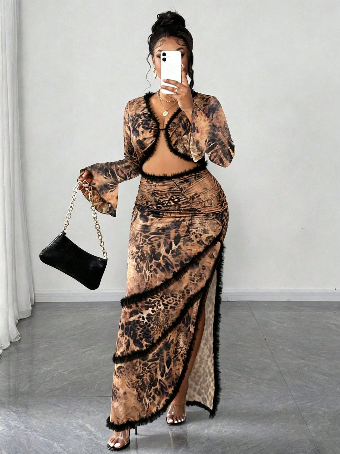 Turn heads in this bold leopard print flare sleeve dress that celebrates curves with confidence. The fitted silhouette hugs you in all the right places, while the dramatic fishtail hem adds a touch of glamorous flair. Fluttery bell sleeves frame your arms beautifully, making this the perfect statement piece for nights out or special occasions. Available in extended sizes because fabulous comes in every size. Roar into any room feeling like the main character you are.