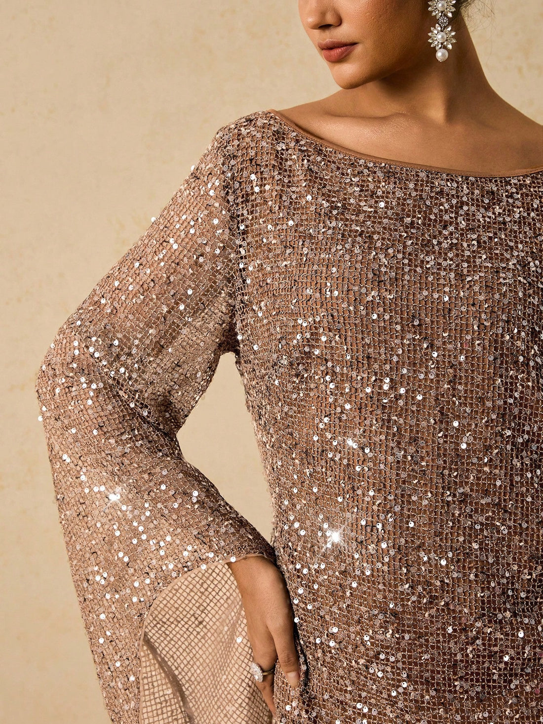 Shine bright through the season in this show-stopping sequin flare sleeve dress! Designed for curves and confidence, this versatile piece transitions seamlessly from autumn gatherings to holiday parties. The shimmering sequin details catch the light beautifully, while flared sleeves add a touch of dramatic flair. Whether you're celebrating Halloween, ringing in the New Year, or attending a Christmas bash, this dress delivers instant glamour and comfort. Perfect for anyone who loves to make a statement and c