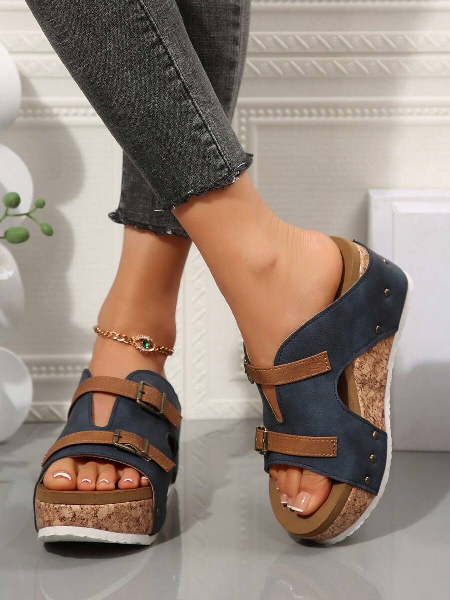 Step into summer with these playful plus size wedge heel sandals! Featuring double buckle straps and eye-catching rivet details, they add a bold twist to warm-weather outfits. Comfortable yet stylish, the wedge heel gives you a lift while keeping you grounded for all-day fun. Perfect for sunny strolls, beach days, or casual gatherings where you want to stand out with effortless charm.