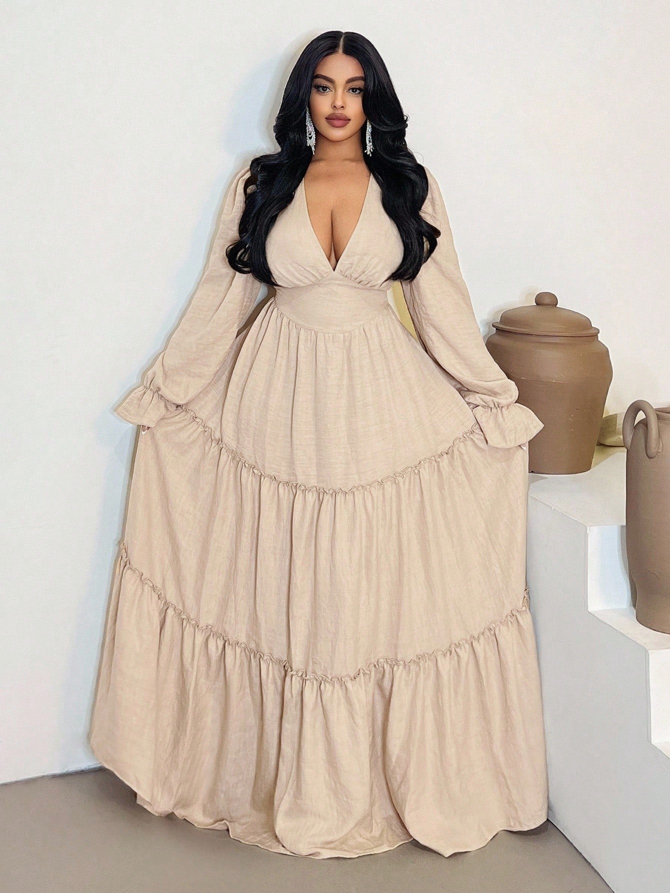 Embrace your curves with confidence in this fabulous plus-size dress! The plunging V-neckline draws attention where you want it, while long sleeves keep things sophisticated and seasonally appropriate. A charming ruffle hem adds movement and personality to every step. Perfect for transitioning from summer to fall, this versatile piece works for casual outings or dressed-up occasions. The flattering cut celebrates your silhouette while the playful ruffle detail keeps things fun and flirty. Comfort meets styl