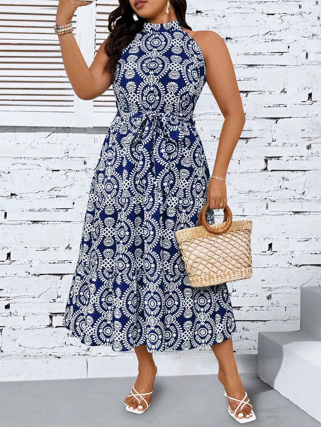 Turn heads with this playful plus size printed halter neck maxi dress. Its flowing silhouette and vibrant pattern make it perfect for effortless style at any summer outing or casual event. The halter neck adds a flirty touch while providing comfortable support, letting you move freely and confidently all day long. Embrace fun fashion that celebrates your curves with ease and charm.