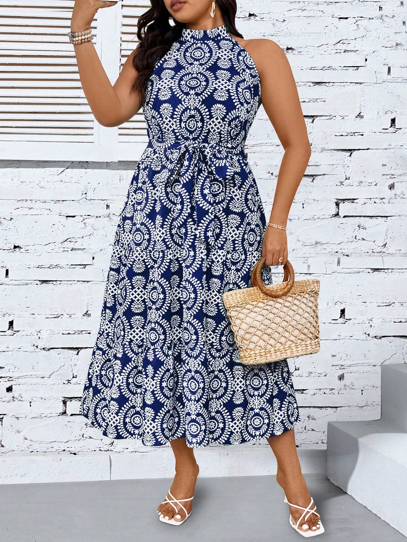Turn heads with this playful plus size printed halter neck maxi dress. Its flowing silhouette and vibrant pattern make it perfect for effortless style at any summer outing or casual event. The halter neck adds a flirty touch while providing comfortable support, letting you move freely and confidently all day long. Embrace fun fashion that celebrates your curves with ease and charm.