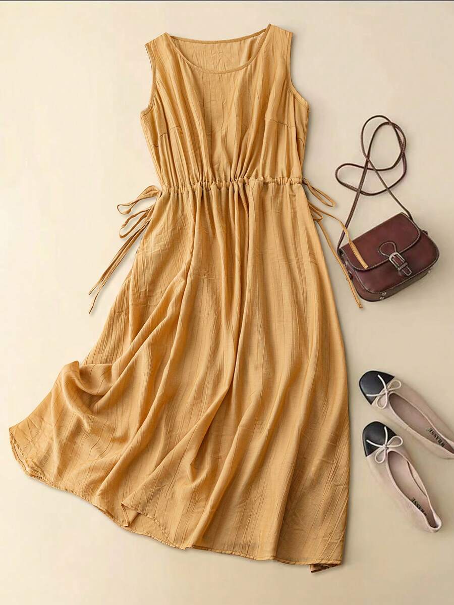 Embrace effortless charm with this playful plus size sleeveless dress. Featuring a flattering round neck and adjustable drawstring waist, it offers both comfort and style in a solid, versatile color. Perfect for sunny days or casual outings, this dress lets you move freely while looking fabulous.