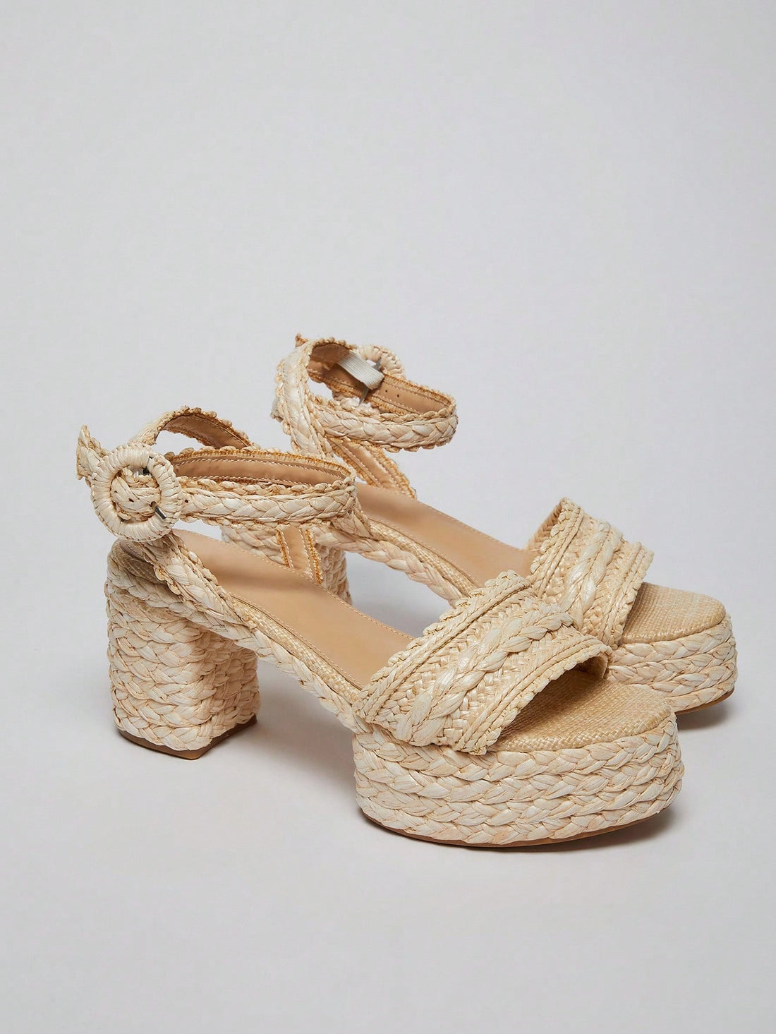Step into summer with these Stylish Raffia Chunky Heel Platform Sandals! Their playful design and sturdy chunky heel add height and confidence, while the natural raffia texture keeps your look fresh and breezy. Perfect for sunny days and trendy outings, these sandals blend comfort with eye-catching style effortlessly.