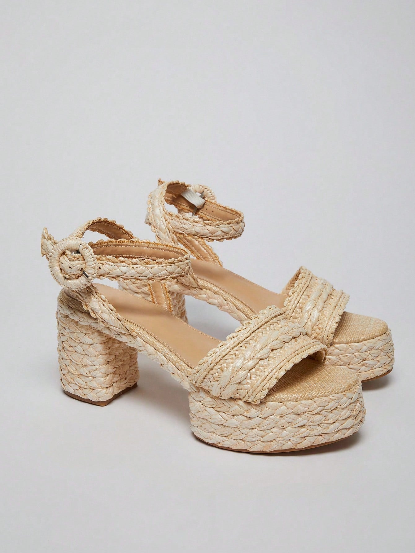 Step into summer with these Stylish Raffia Chunky Heel Platform Sandals! Their playful design and sturdy chunky heel add height and confidence, while the natural raffia texture keeps your look fresh and breezy. Perfect for sunny days and trendy outings, these sandals blend comfort with eye-catching style effortlessly.