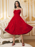 Turn heads in this stunning red strapless dress that perfectly blends elegance with fun! The charming bow detail adds a touch of sophistication at the neckline, while the playful bubble hem creates movement and dimension. Cut to a flattering mid-length silhouette, this versatile piece transitions seamlessly from date night to special occasions. Whether you're dressing up for a celebration or making a bold statement, this dress delivers style and confidence in every wear.