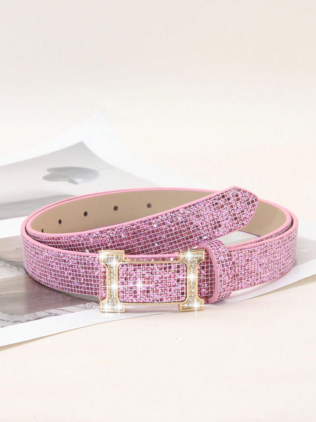Elevate any outfit with our Stylish Rhinestone-Embellished PU Leather Belt. Featuring a smooth buckle and sparkling rhinestones, this belt is perfect for any occasion. Made of high-quality PU leather, it adds a touch of elegance to your wardrobe. Upgrade your style game with this must-have accessory.