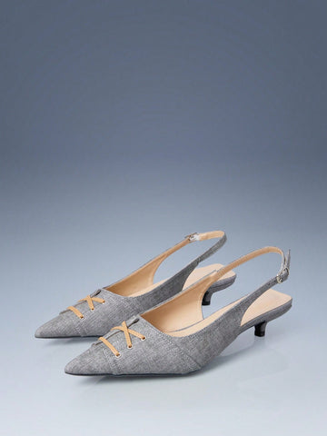 Discover refined footwear that seamlessly transitions from boardroom to evening engagements. These kitten heel pumps feature a gracefully pointed toe that flatters the foot's silhouette, paired with a stabilizing ankle strap for secure all-day wear. The understated heel height delivers professional polish without sacrificing comfort, making these pumps an intelligent choice for women who demand versatility. Their streamlined design complements an array of outfits—from professional separates to feminine dres
