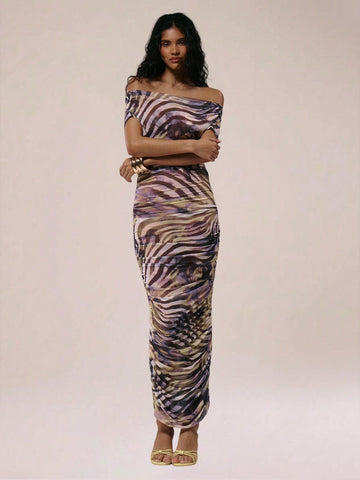Turn heads with this playful sheer off-shoulder bodycon dress featuring a bold animal print. Its fitted silhouette hugs your curves, while the sheer fabric adds a flirty touch. Perfect for dancing the night away or making a statement at any party, this dress combines daring style with effortless confidence. Step out and own the night!