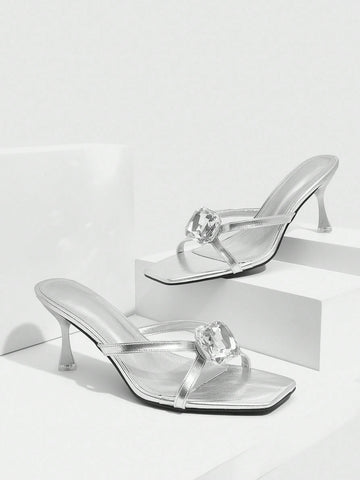 Step into sophistication with these stunning silver criss-cross high heel sandals, where elegance meets eye-catching sparkle. The intricate glass embellishments catch the light beautifully, adding a touch of glamour to any outfit. Designed with a flattering criss-cross strap detail, these heels offer both style and comfort for nights out, special occasions, or whenever you want to feel fabulous. Perfect for elevating your wardrobe with a shoe that's equal parts chic and show-stopping.