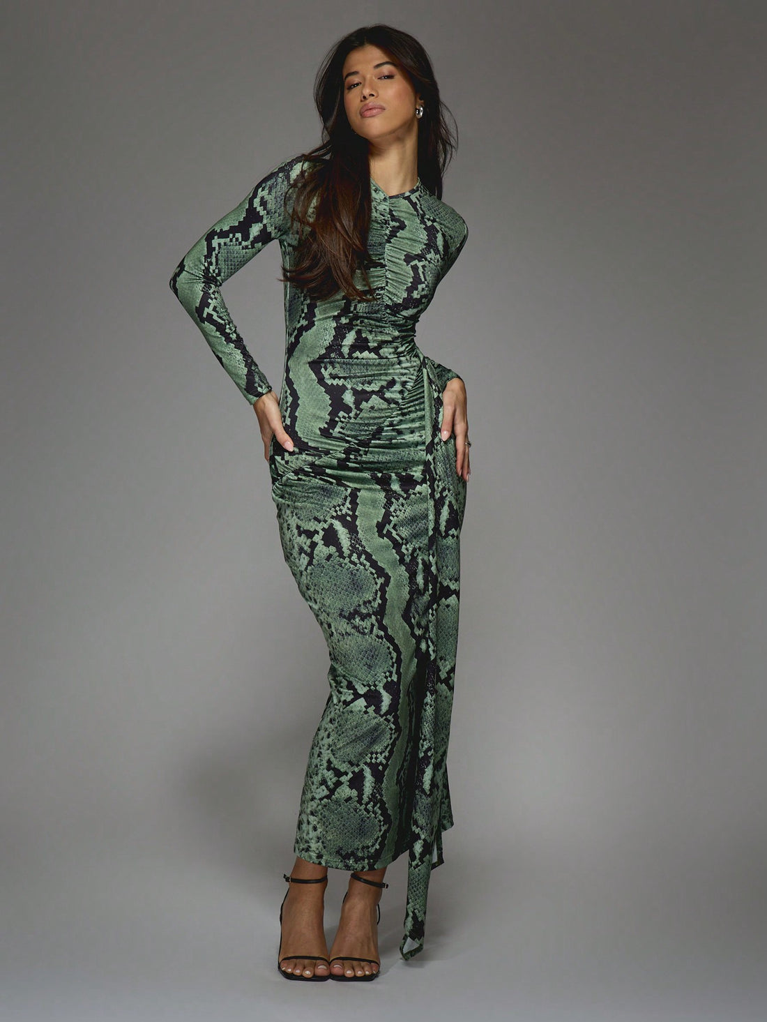 Get ready to slither into style with our Stylish Snake Print Asymmetric Maxi Dress! With its unique snake print design and eye-catching ruched sides, you'll be sure to turn heads. And let's not forget the daring side slit for a touch of sass. It's a must-have for any fashion-forward wardrobe!