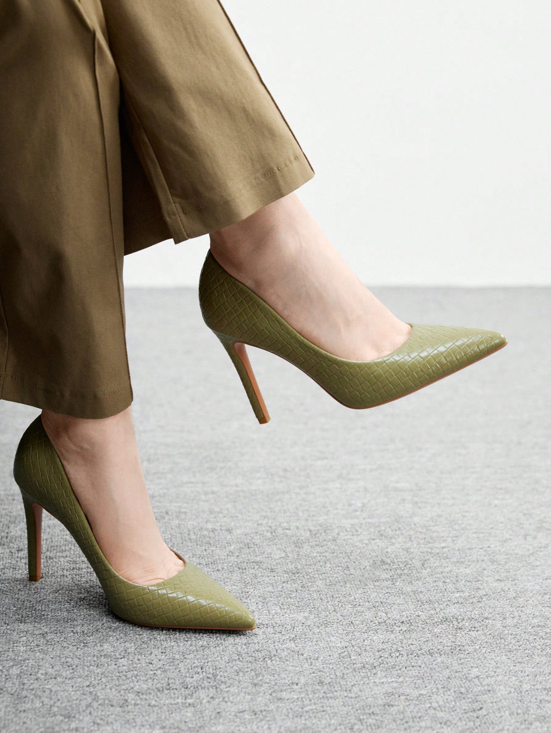 Step into sophistication with these stunning pointed-toe high heels! Crafted in a timeless solid color, they're the ultimate everyday essential that transitions seamlessly from office to evening plans. The sleek silhouette elongates your legs while the classic design pairs effortlessly with any outfit in your wardrobe. Whether you're conquering your commute or heading out for something special, these heels deliver instant polish and confidence. Comfortable enough for all-day wear, they're your new go-to for