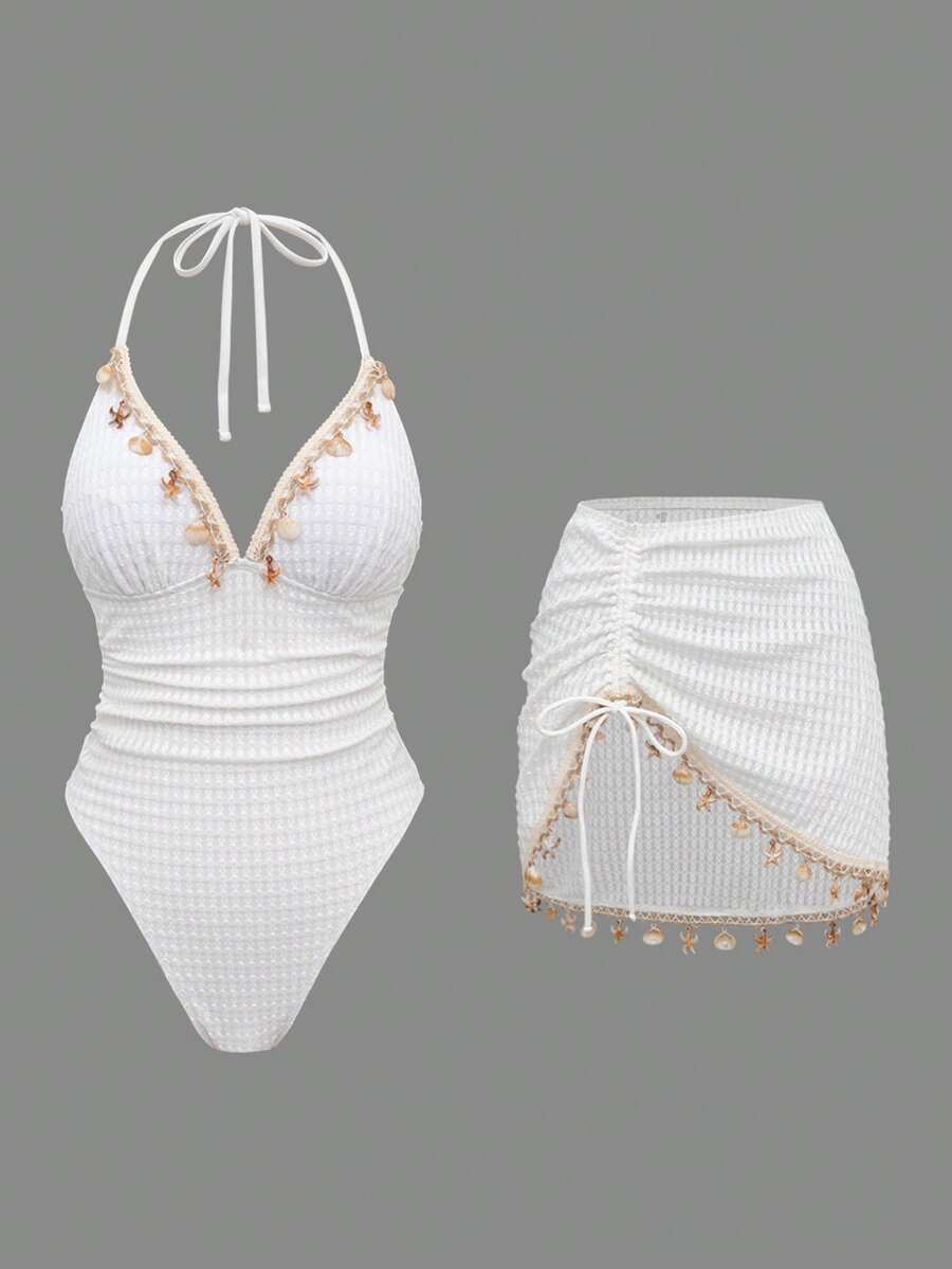 Make a splash this season with our versatile swimwear collection. The triangle bikini top offers a classic, flattering fit perfect for any beach day, while the ruched one-piece swimsuit provides elegant coverage with a sculpted silhouette. Both styles feature eye-catching shell chain accents that add a touch of coastal charm and sophistication. Available in timeless solid colors, these pieces are designed to mix, match, and transition seamlessly from poolside to seaside.