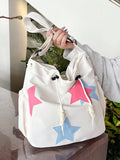 The Stylish Starry Summer Tote is a large capacity shoulder bag designed for students. With a trendy starry pattern and ample storage space, this tote combines fashion and function. Perfect for carrying books, laptops, and essentials, it's the perfect accessory for students on the go.