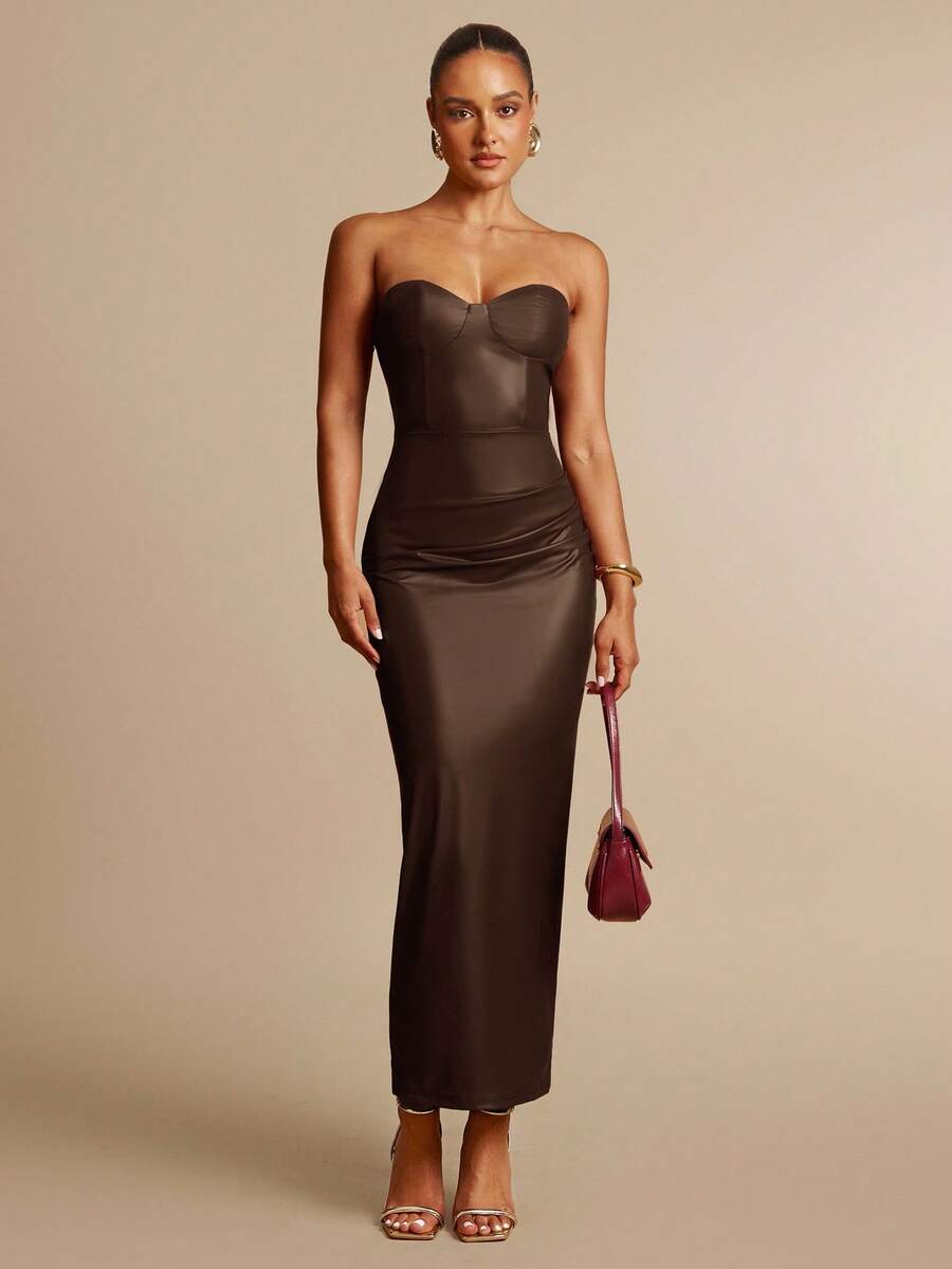 Turn heads this season with our Stylish Strapless Faux Leather Midi Dress—your go-to for fall and winter fun! Sleek and edgy, this dress hugs your curves while keeping you cozy enough for chilly nights. Whether it’s a night out or a festive gathering, its strapless design adds a flirty touch that’s sure to boost your confidence. Embrace cool-weather style with a playful edge!