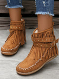 Perfect for adding some edge to your wardrobe, these stylish flat boots feature a unique combination of studs and fringe detailing. With a classic round toe design and convenient side zipper, these boots are both fashionable and functional. Take your outfit to the next level with these statement-making boots.