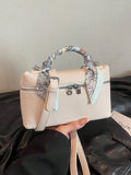 Add a pop of fun to your outfit with this Stylish Texture Solid Color Handbag! This versatile crossbody comes with a chic scarf and a 3D cosmetic pouch, perfect for keeping your essentials organized and your look on point. Whether you're out for a casual day or a night on the town, this bag brings playful style and practical charm wherever you go.