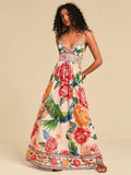Embrace effortless elegance with this stunning V-neck floral maxi dress. Featuring a backless design with delicate ruffles and shirring details, this boho-inspired piece is perfect for spring and summer getaways, beach days, and special occasions. The high-waisted silhouette and flared hem create a flattering, feminine look, while spaghetti straps keep it comfortable and breezy. 