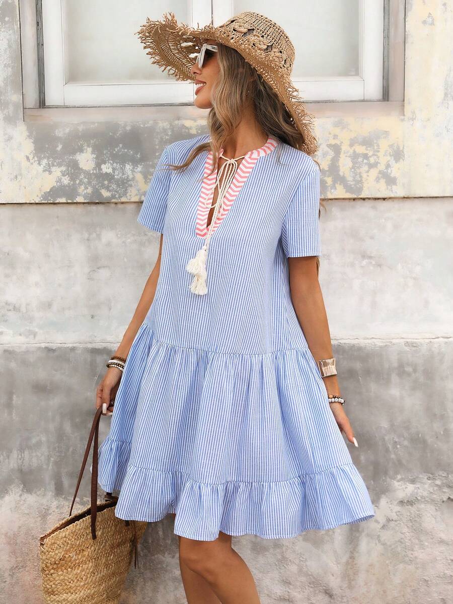 Embrace effortless style with this charming V-neck A-line dress, perfect for spring and summer adventures. Featuring playful patchwork details, delicate fringe trim, and a flounce hem, this piece combines comfort with contemporary flair. The short sleeve design and low waist silhouette create a flattering, relaxed fit ideal for vacations and casual outings. Crafted from a breathable woven blend of polyester, cotton, and viscose, this semi-sheer dress offers versatile wear for warm-weather occasions. Machine