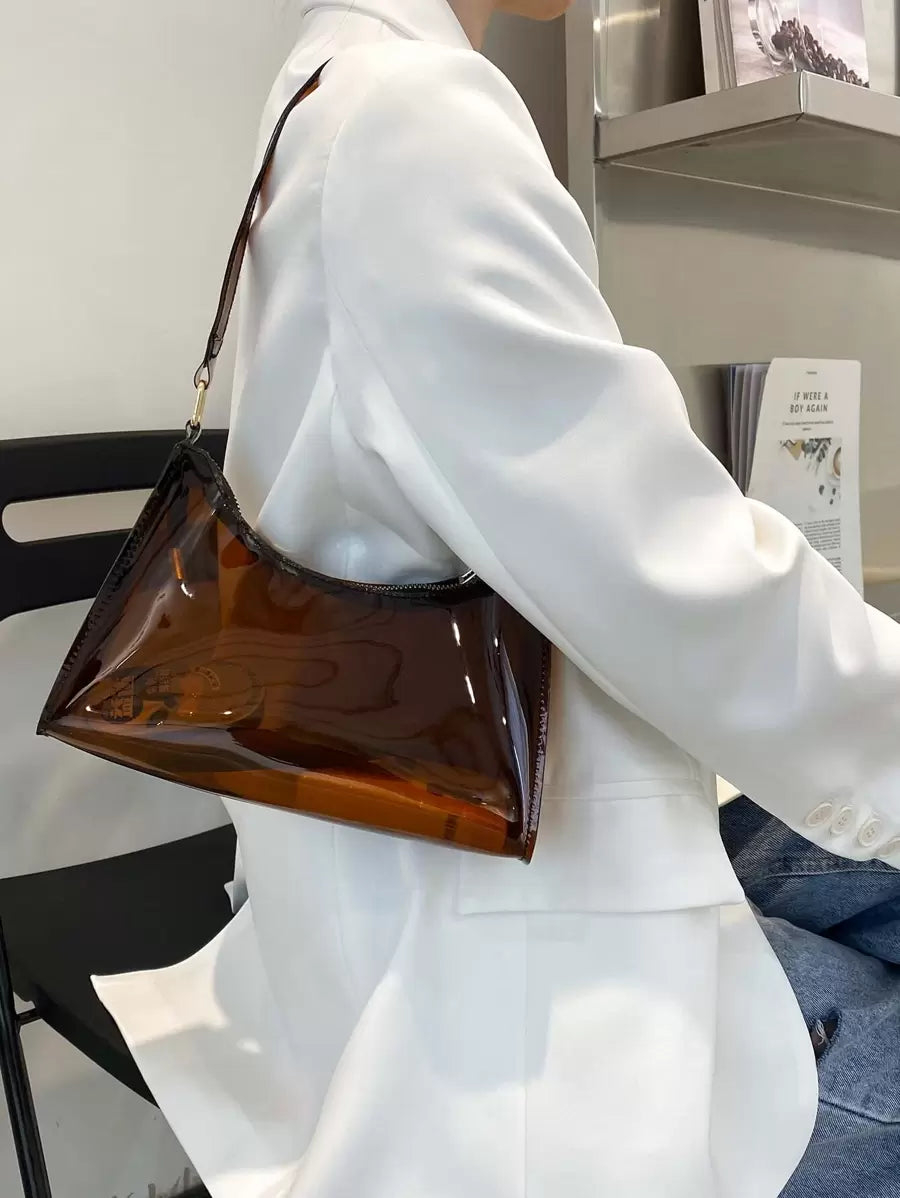 Keep your essentials dry and on display with this playful, waterproof transparent PVC shoulder bag. Perfect for beach days, sports events, or casual outings, it combines style with practicality. Lightweight and durable, it lets you carry your must-haves while showing off your fun, carefree vibe wherever you go.