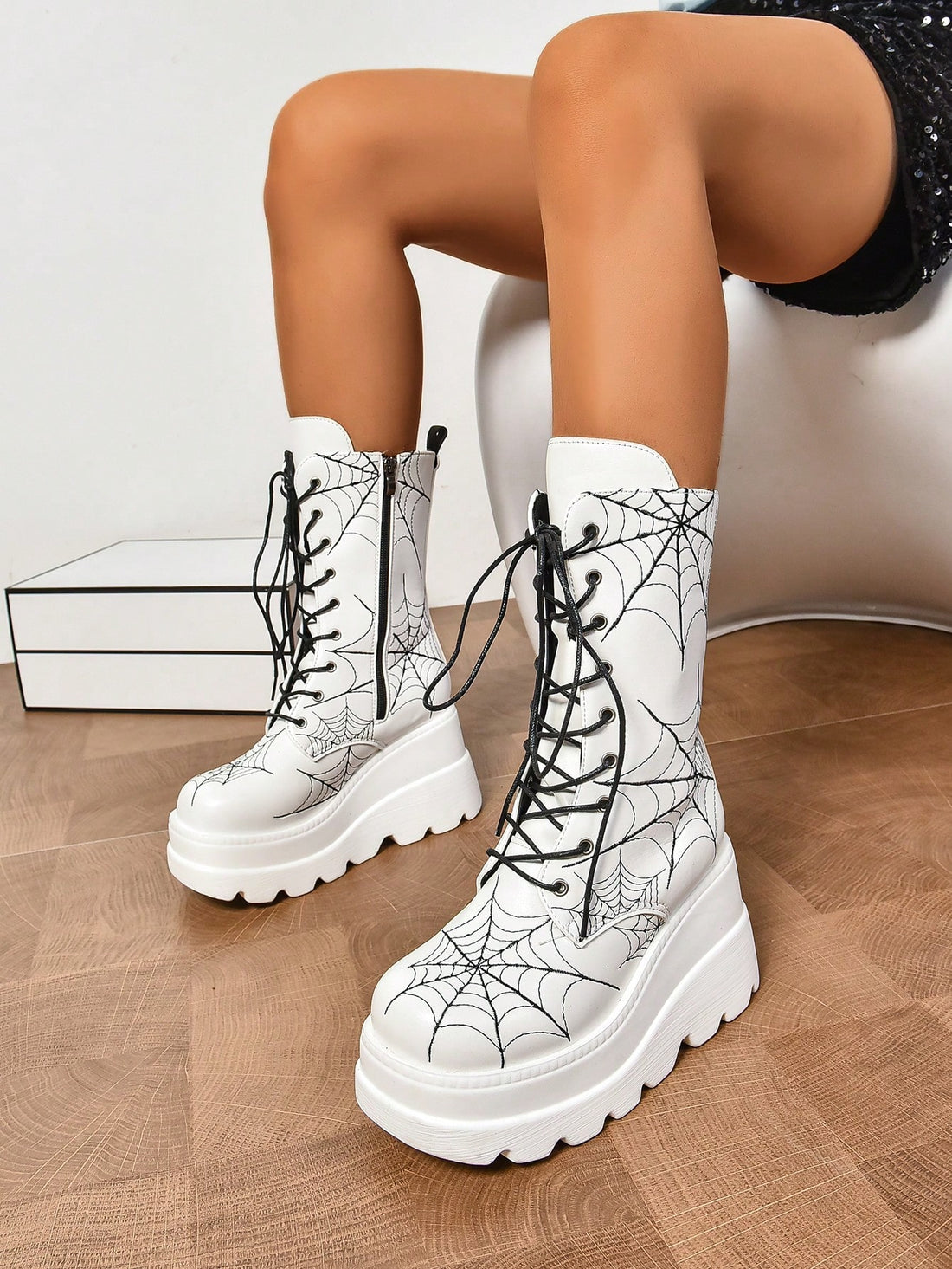 Upgrade your shoe collection with these stylish white lace-up mid-calf boots. With thick soles, these boots make the ultimate statement piece. Perfect for any occasion, their sleek and modern design will elevate your look and provide optimal comfort. 