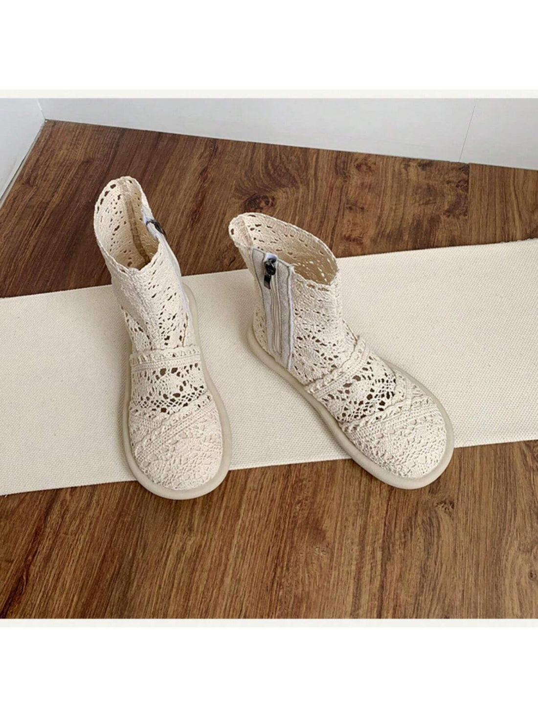 Step out in style with these playful white lace ankle boots! Featuring a comfy flat heel and a round toe, they’re perfect for casual days when you want to add a touch of charm. The convenient zipper closure makes slipping them on a breeze, while the delicate lace design keeps your look fresh and fun. Perfect for pairing with your favorite jeans or dresses, these boots bring a flirty twist to everyday footwear.