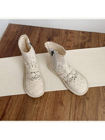 Step out in style with these playful white lace ankle boots! Featuring a comfy flat heel and a round toe, they’re perfect for casual days when you want to add a touch of charm. The convenient zipper closure makes slipping them on a breeze, while the delicate lace design keeps your look fresh and fun. Perfect for pairing with your favorite jeans or dresses, these boots bring a flirty twist to everyday footwear.