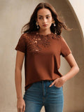 Elevate your warm-weather wardrobe with this charming white tee that blends casual comfort with boho-chic flair. Delicate lace crochet patchwork details add texture and visual interest, making it a standout piece for beach getaways, weekend adventures, or romantic occasions. The relaxed fit keeps you cool and comfortable, while the intricate crochet accents give off effortless, laid-back vibes. Whether you're strolling along the shore or dressing up for a special date, this versatile tee pairs beautifully w