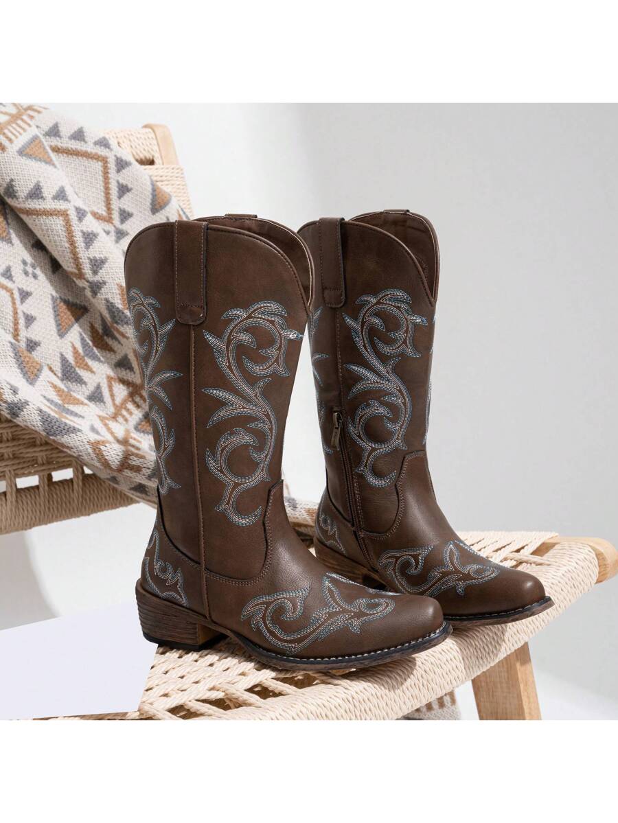 Step into bold style with these white and black square toe cowboy boots designed for women. Featuring intricate embroidery and a convenient inner zipper, they blend classic Western flair with modern ease. Perfect for adding a fun, fashionable twist to any outfit while keeping your feet comfortable and secure all day long.