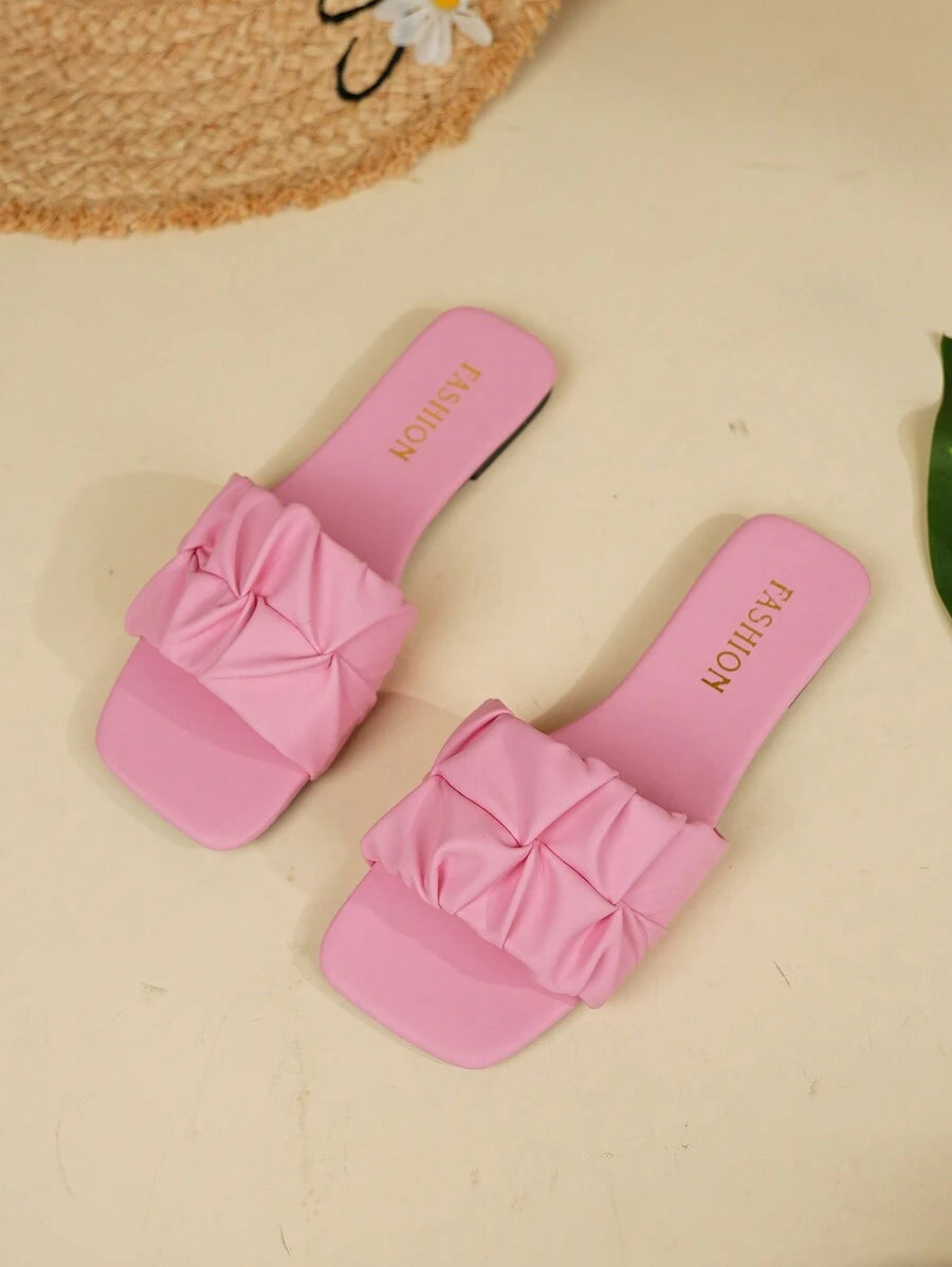 Step into summer with these stylish women's flip flops designed for both comfort and fun. Featuring a unique square toe and soft, cushioned sole, they provide all-day ease whether you're strolling the beach or hanging out with friends. The anti-slip sole keeps you steady on your feet while adding a trendy touch to your casual look. Perfect for warm days, these flip flops blend playful flair with practical comfort effortlessly.