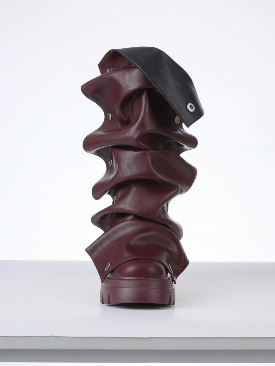 Step out in style with these black mid-calf slouchy boots designed to turn heads at the motorcycle rally or the nightclub. Featuring a comfortable stacked heel, they blend edgy attitude with playful charm, making every step a statement. Perfect for those who love to mix bold fashion with effortless cool.